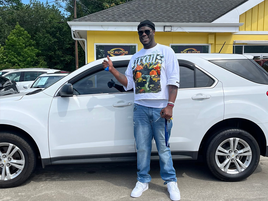 10K Autos customer picking up a car in Greenville