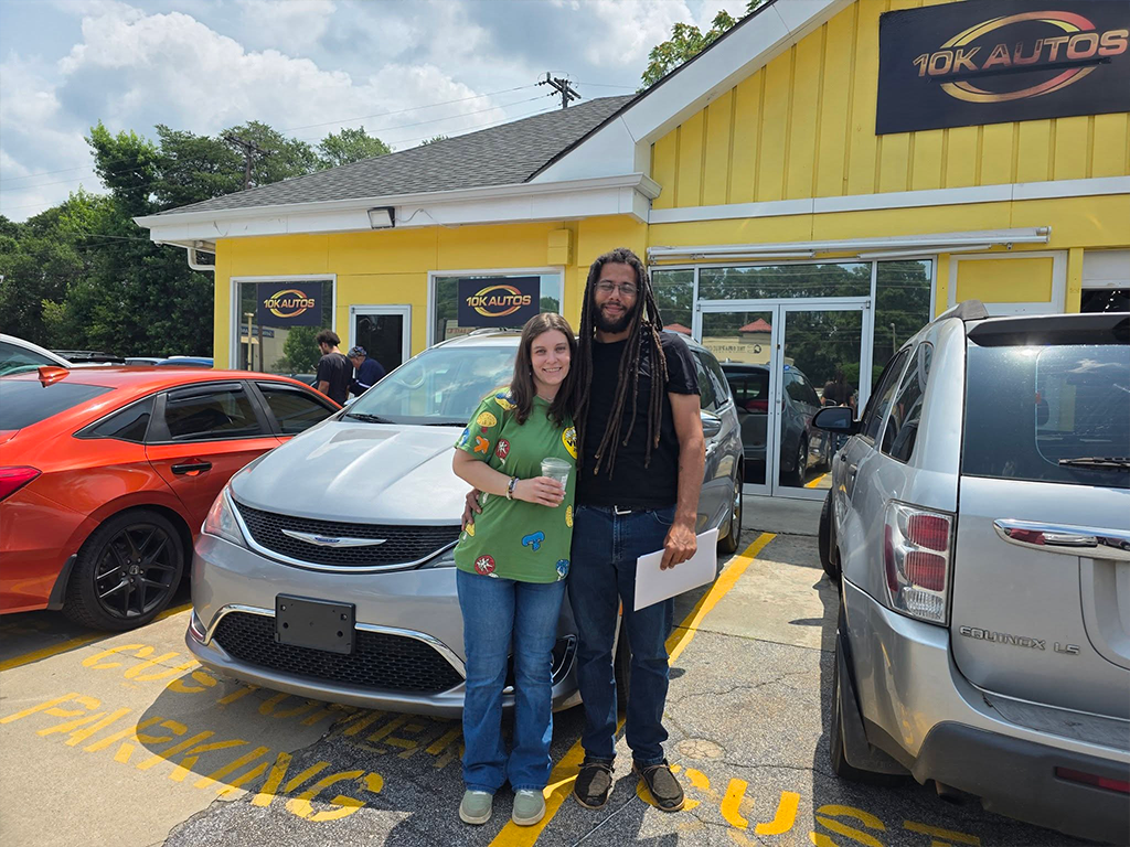 10K Autos customer with a new car in Greenville